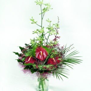 TROPICAL JUNGLE Modern hand tied arrangement in a glass vase